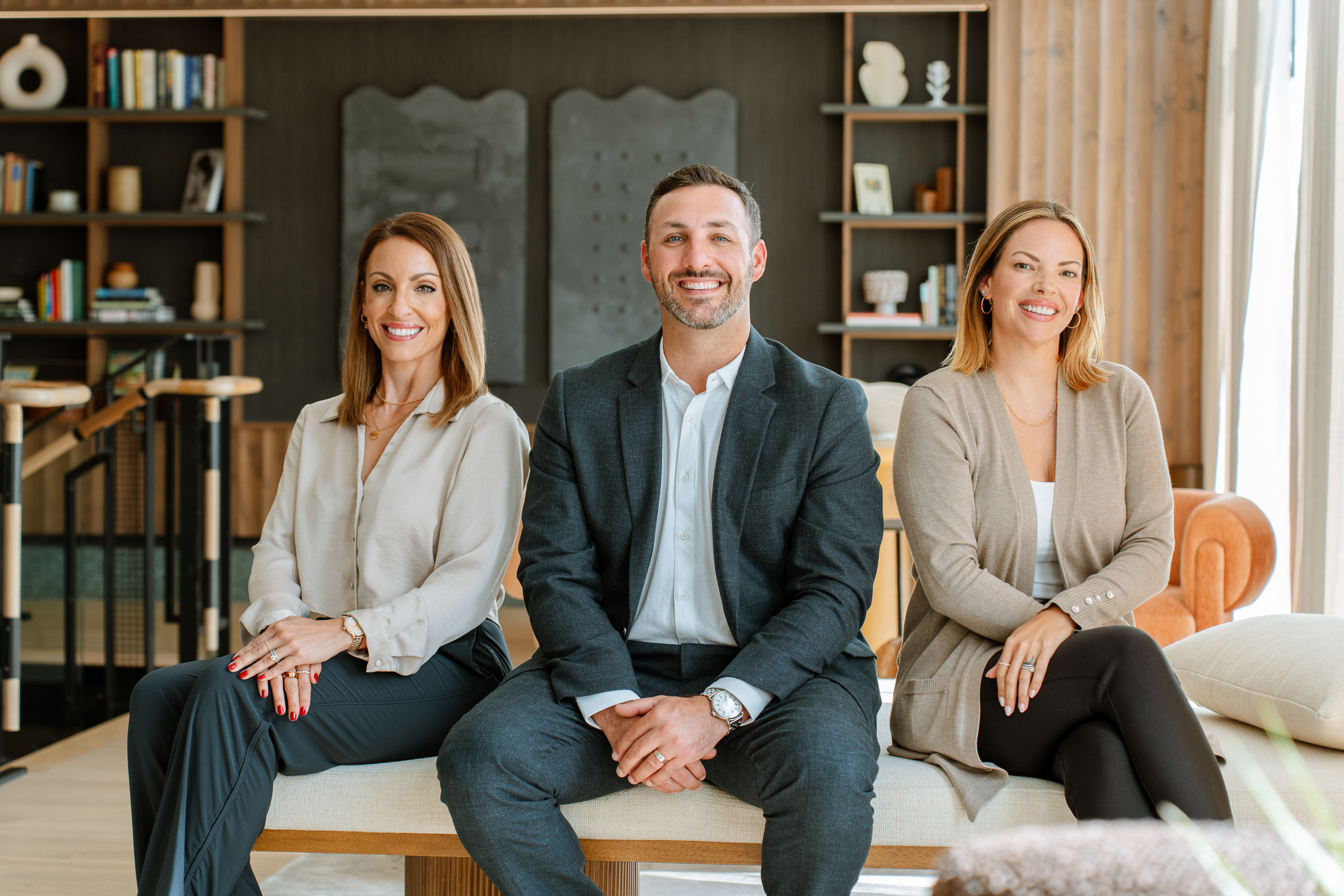 A creative team seated together in a studio